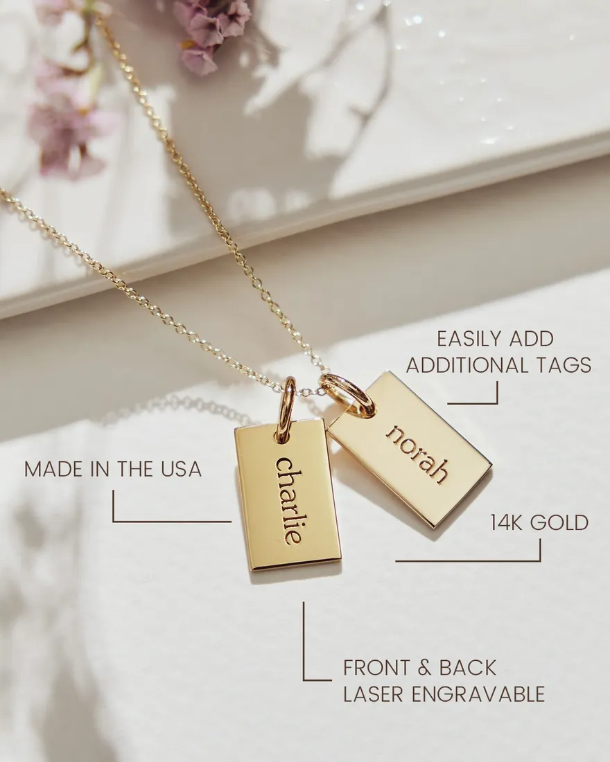 Tiny Tags gold name tags on a fine chain, engraved charlie and norah